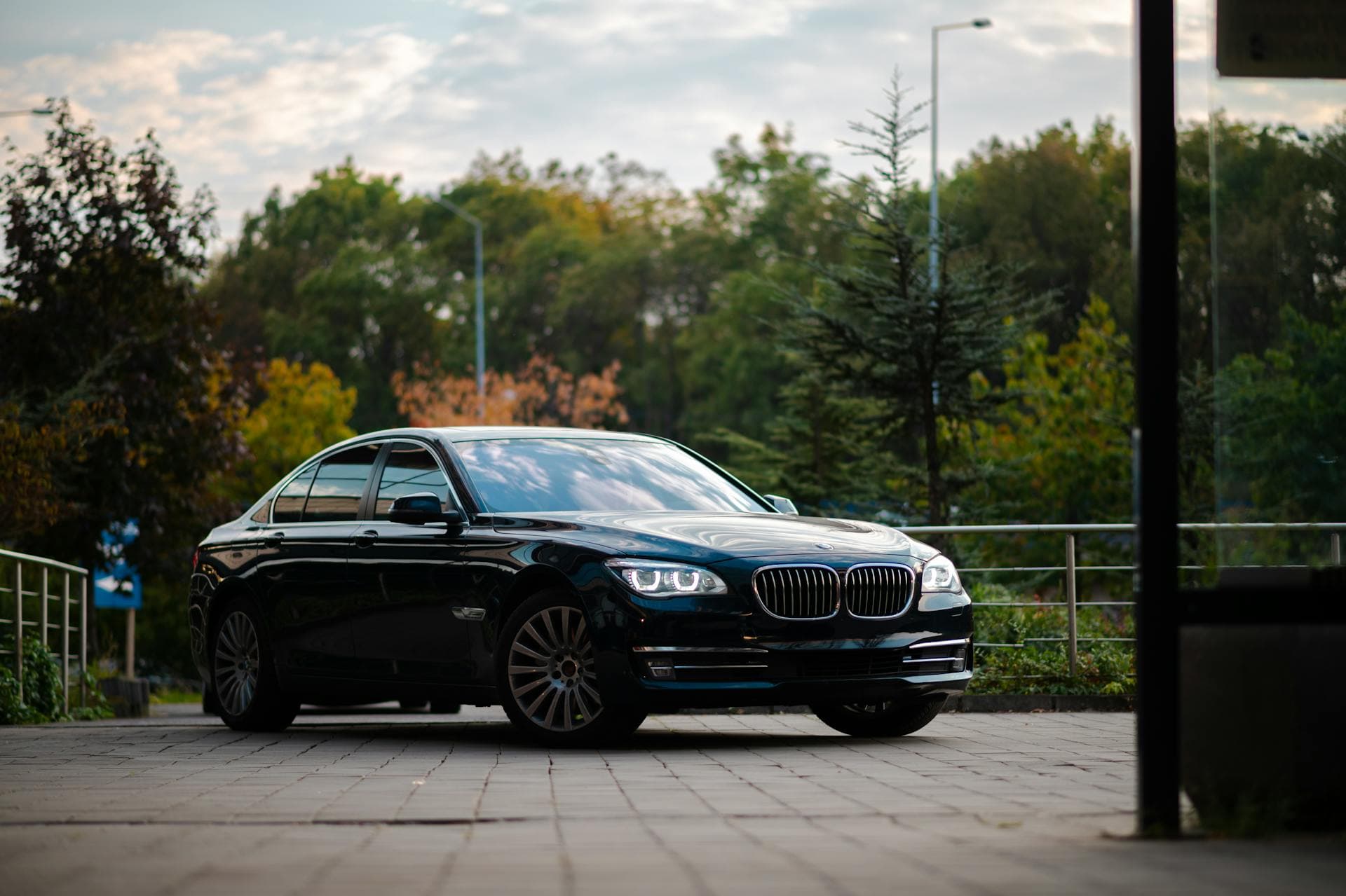 Black BMW 7 Series sedan parked beside lush foliage, Adelaide Oval Test cricket chauffeur parking guide