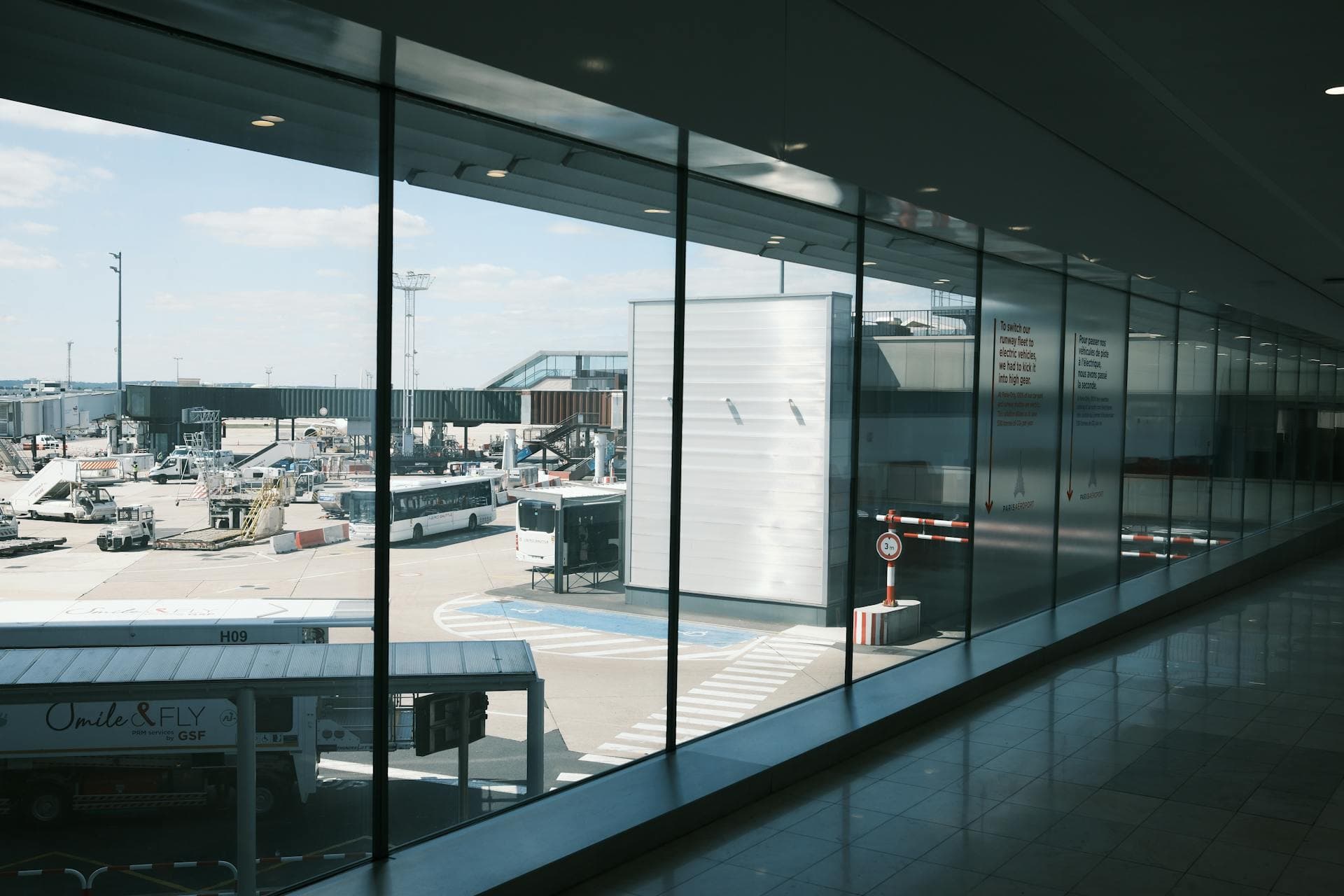 Modern airport terminal hallway with passengers, Adelaide airport transfer pricing guide