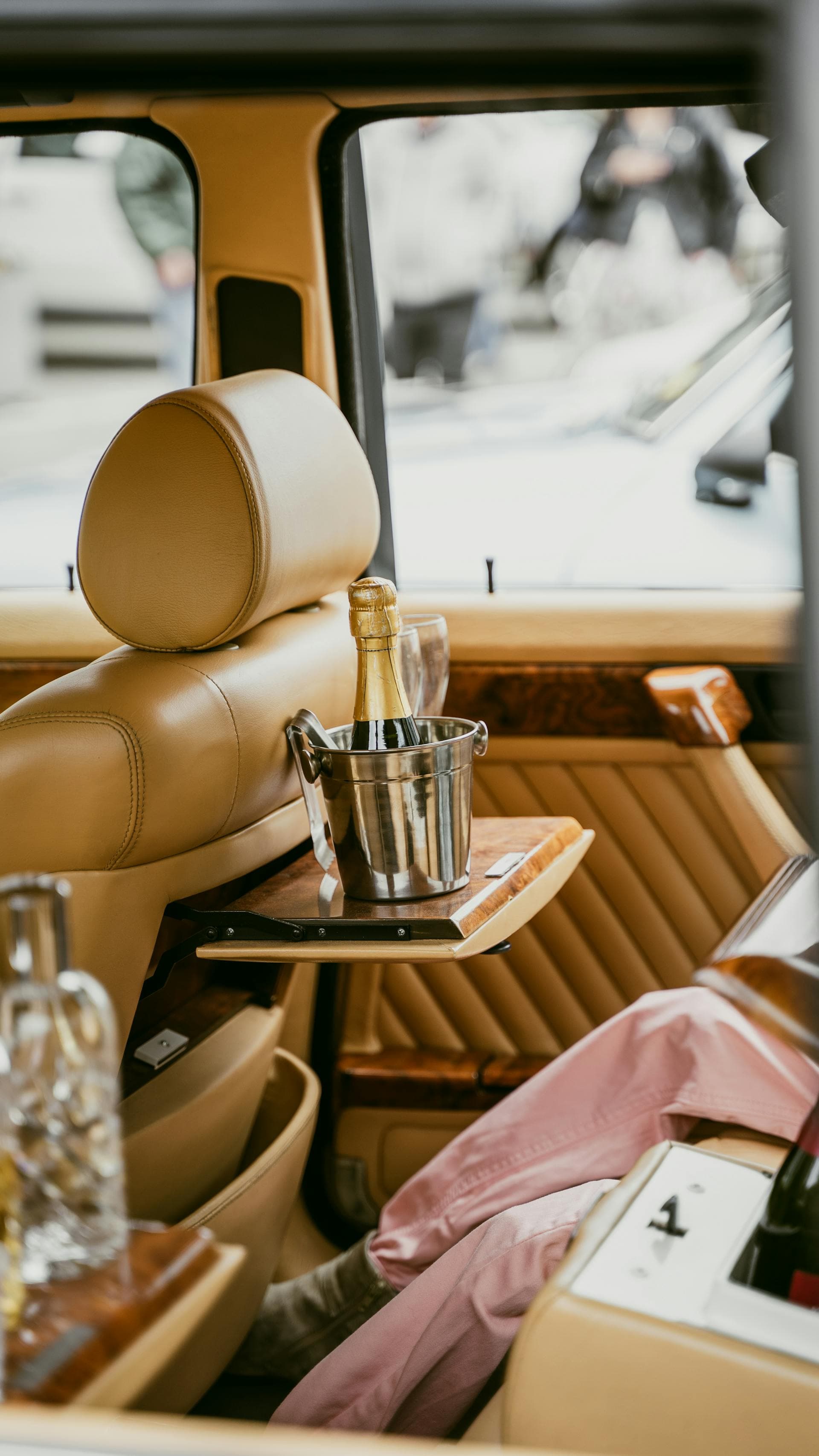 Champagne bottle in ice bucket inside luxury vehicle, Adelaide BYO alcohol limo law