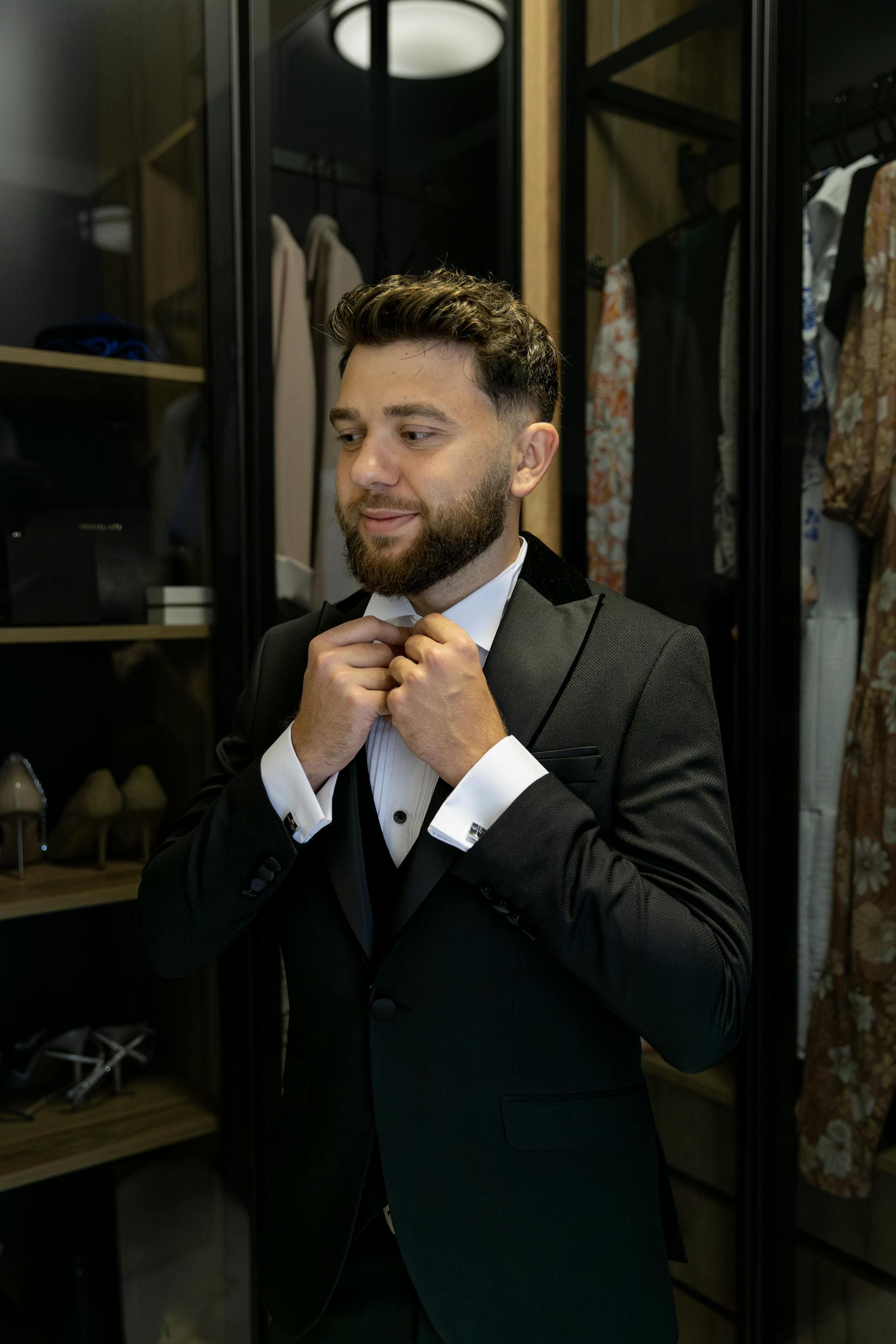Man in tuxedo adjusting bow tie, Adelaide stretch limo formal dress-code guide