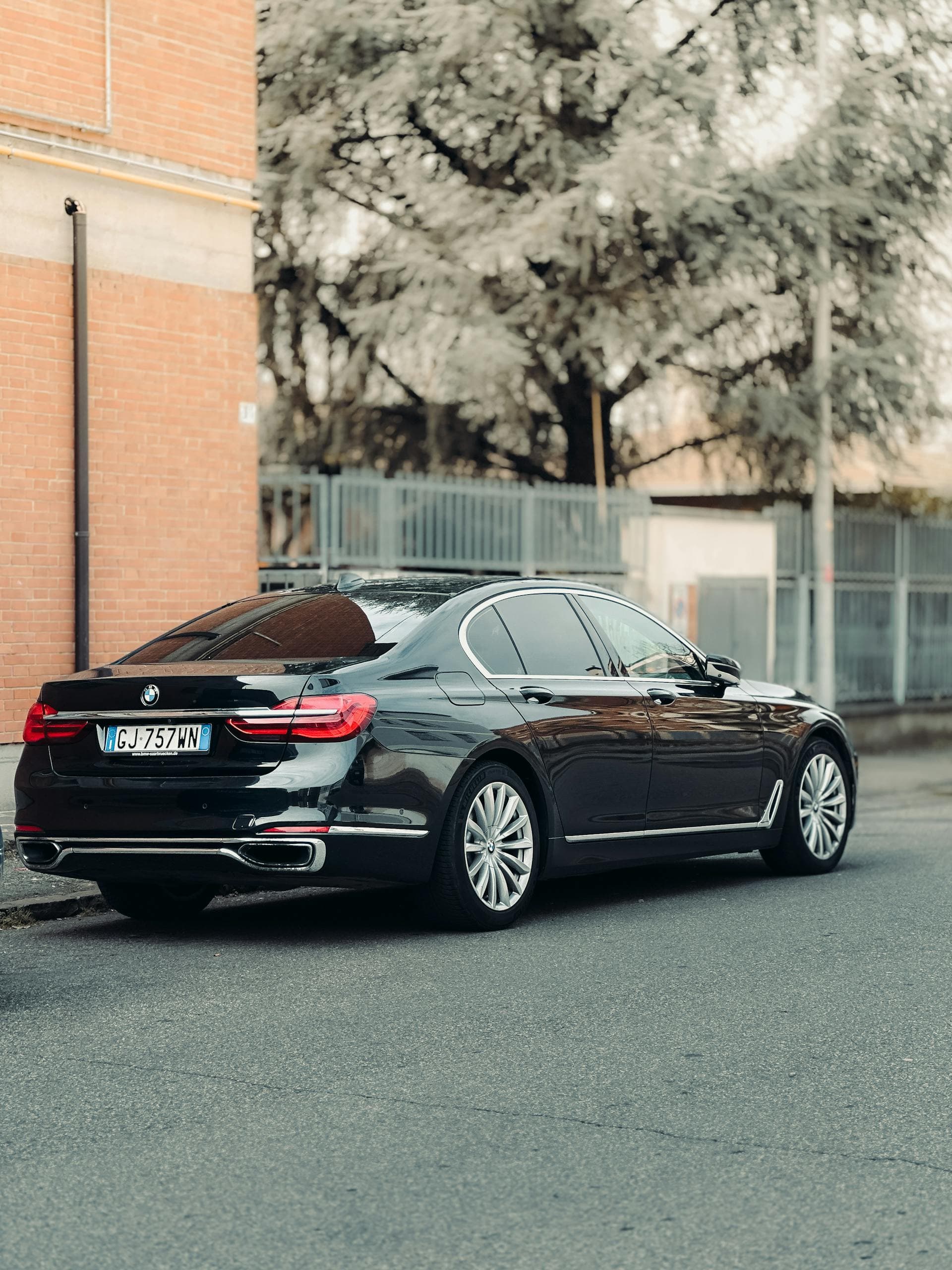 Black BMW 7 Series luxury sedan parked kerbside, Limo Hire Adelaide chauffeur service