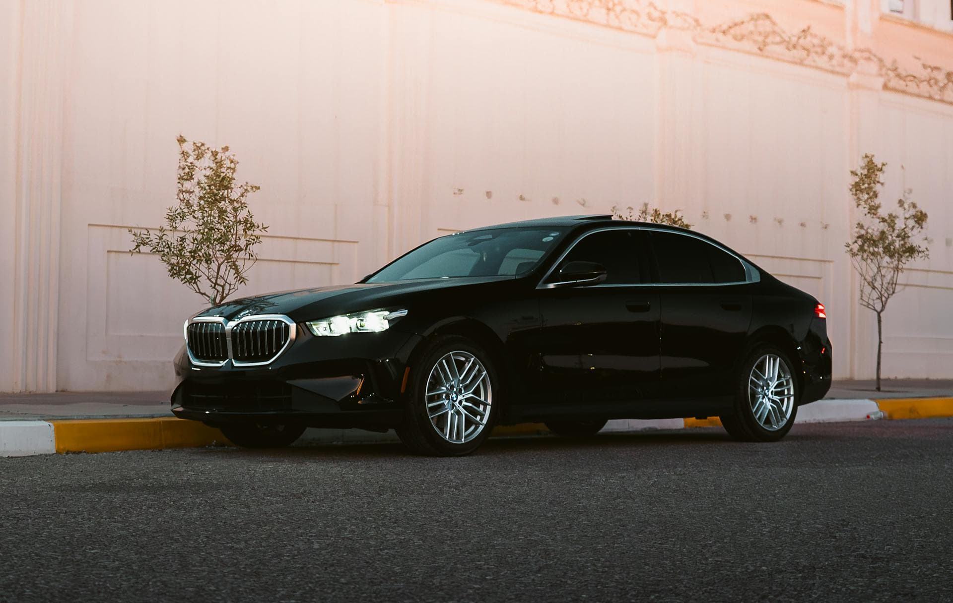 Black Mercedes sedan on a dignified quiet autumn street, Adelaide funeral chauffeur service