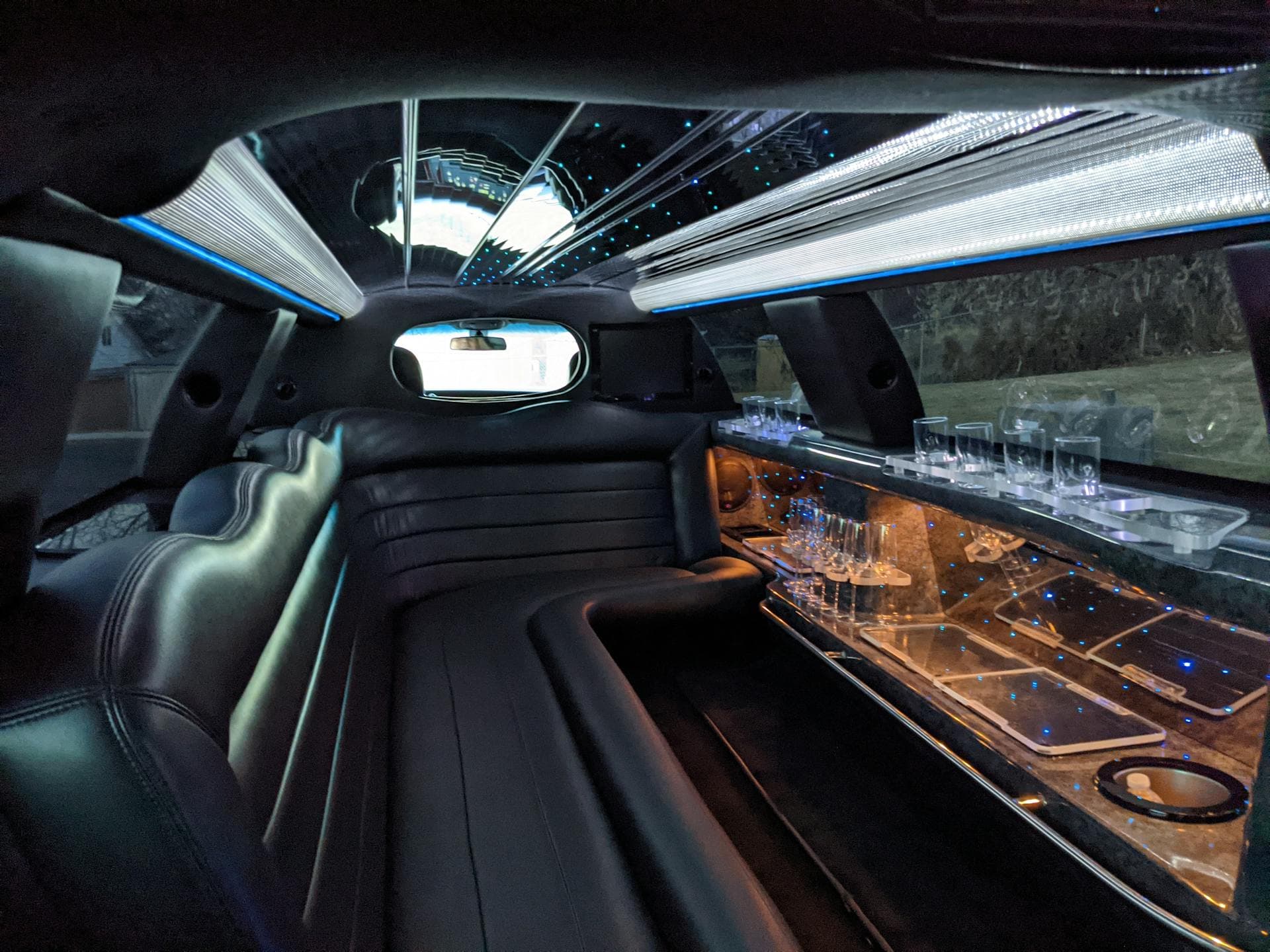 Stretch limousine black leather cabin with LED mood lighting and bar, Adelaide Year 12 formal